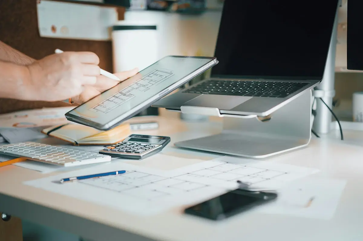 tf-jackson-finance-your-purchase-worker-checks-project-details-on-tablet-at-desk tf-jackson-finance-your-purchase-worker-checks-project-details-on-tablet-at-desk