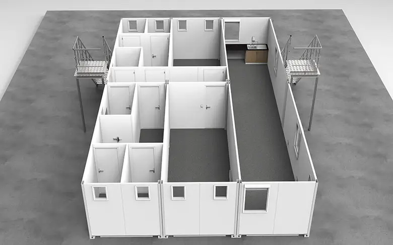 An interior view of a modular office space with partitions forming individual cubicles.