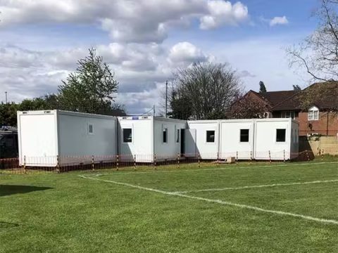 Portable educational facility set up on a school sports field