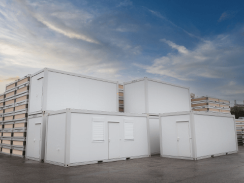 Stacked portable storage containers in a holding facility
