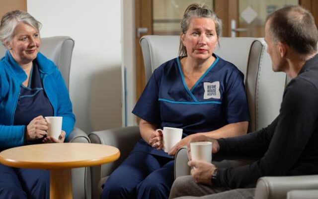 Blythe House Hospice nurses talking to a patient